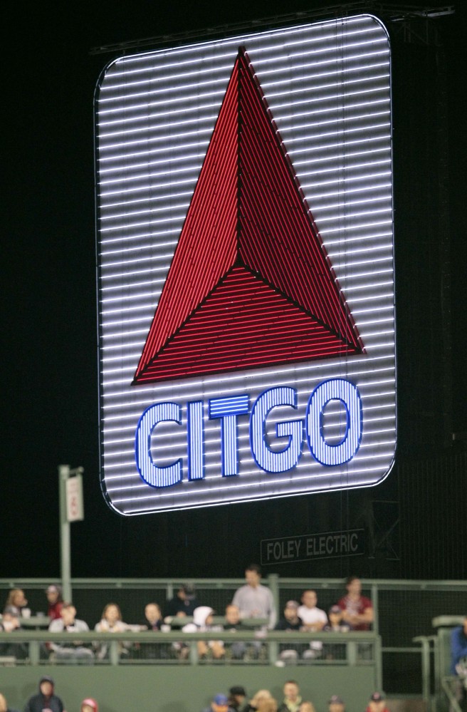In this Sept. 17, 2010 file photo, Boston's Citgo sign is re-lit for the first time after getting refurbished with 218,000 new LED lights during a baseball game between the Boston Red Sox and the Toronto Blue Jays at Fenway Park in Boston. Boston University announced Friday, Aug. 12, 2016 it had reached a deal with developer Related Beal to sell several properties, including the home of the 3,600-square-foot sign.