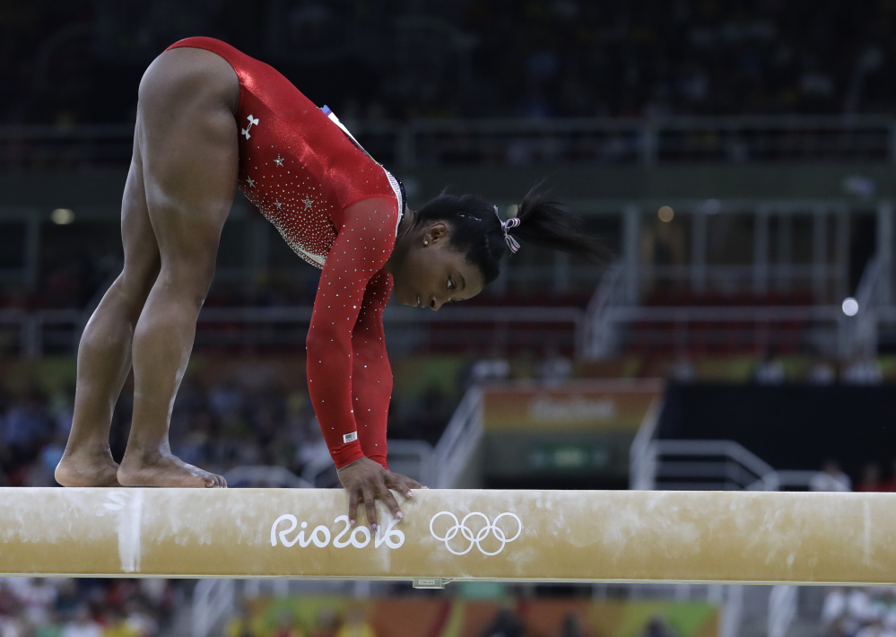 Simone Biles of the U.S. stumbles during her balance beam routine during the artistic gymnastics women's apparatus final at the 2016 Summer Olympics in Rio.