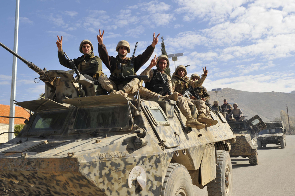 Lebanese soldiers leave Ras Baalbek on Jan. 24, 2015, the day after they defeated an Islamic State attack force. Among the ISIS fighters killed was former Freeport resident Adnan Fazeli.