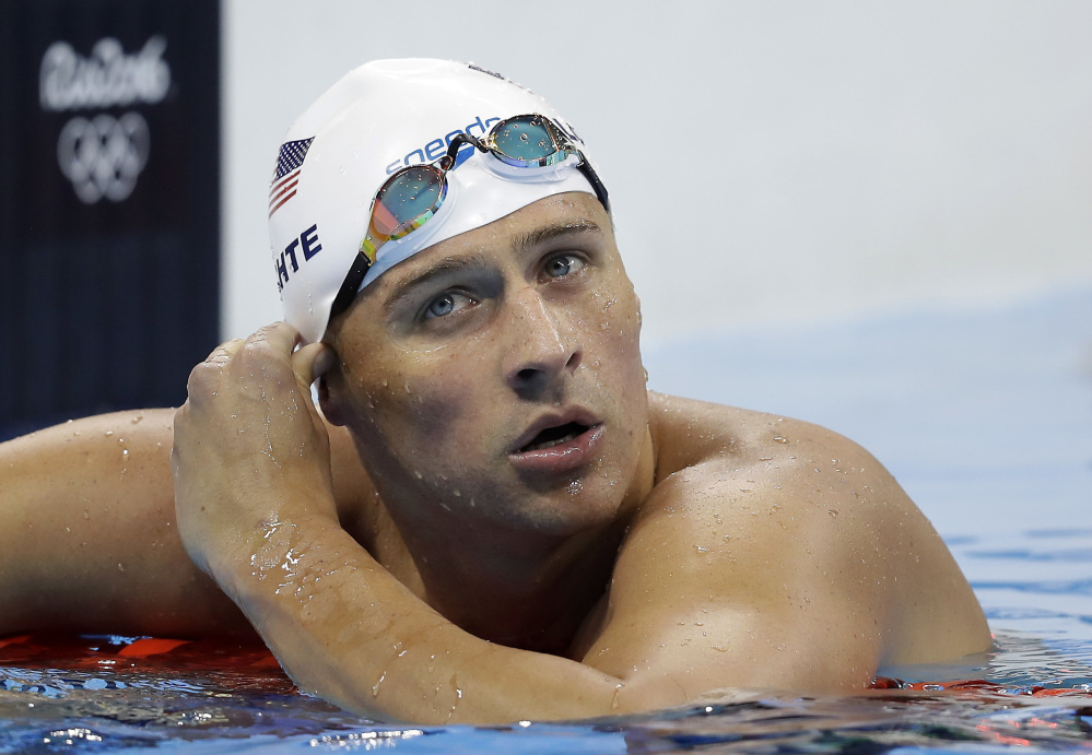 United States' Ryan Lochte checks his time in a men's 4x200-meter freestyle heat during the Summer Olympics, in Rio de Janeiro, Brazil, last week. Lochte and three other American swimmers reported being robbed at gunpoint early Sunday.