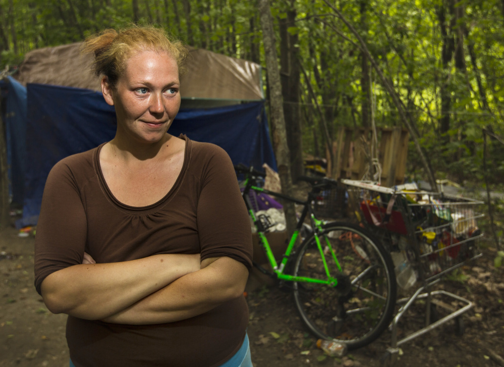 "We're not bothering anybody, so why are (police) bothering us?" asked Tricia Leavitt, 31, a New Hampshire native who is among the residents of Portland's "Tent City." Brighton Avenue on the outskirts of the city. She is one of many homeless campers who face eviction from the camp. (Photo by Ben McCanna/Staff Photographer)