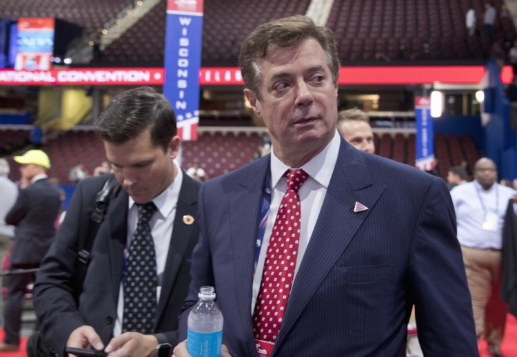 Trump campaign chairman Paul Manafort walks around the convention floor before the opening session of the Republican National Convention in Cleveland in July. He has resigned.