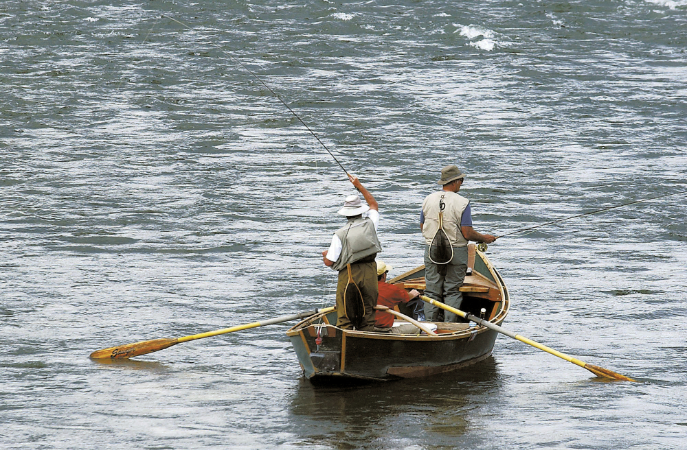 Fly fishermen test their angling skills on the Yellowstone River near Pine Creek, Mont., in September 2004. Montana officials are closing a stretch of the waterway to all recreational activities after a fish kill that was "unprecedented in magnitude." The move will affect outfitters, rafting companies and many other players in the regional economy.