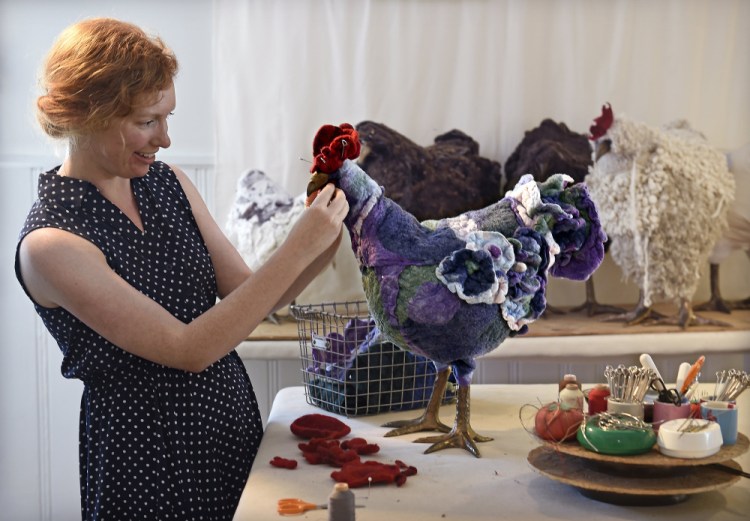 In her studio in Kansas City, artist Sally Jane Linville works on one of her felted wool footstools, that come in the form of a chicken. Each one is unique and has its own name.    Rich Sugg/Kansas City Star/TNS