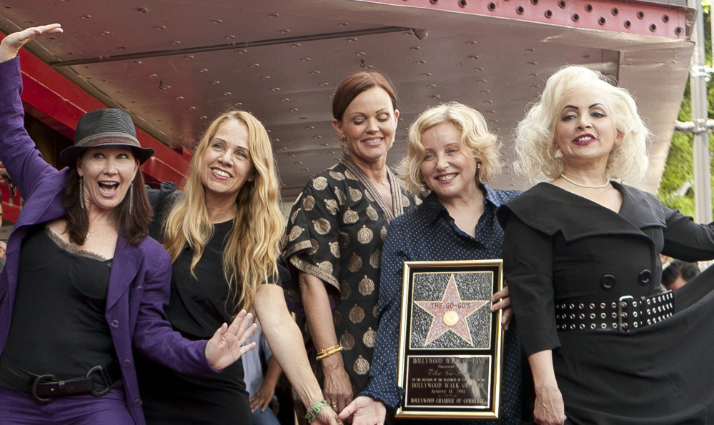 The Go-Go's were Kathy Valentine, from left, Charlotte Caffey, Belinda Carlisle, Gina Schock and Jane Wiedlin in 2011. Valentine left the band in 2013.