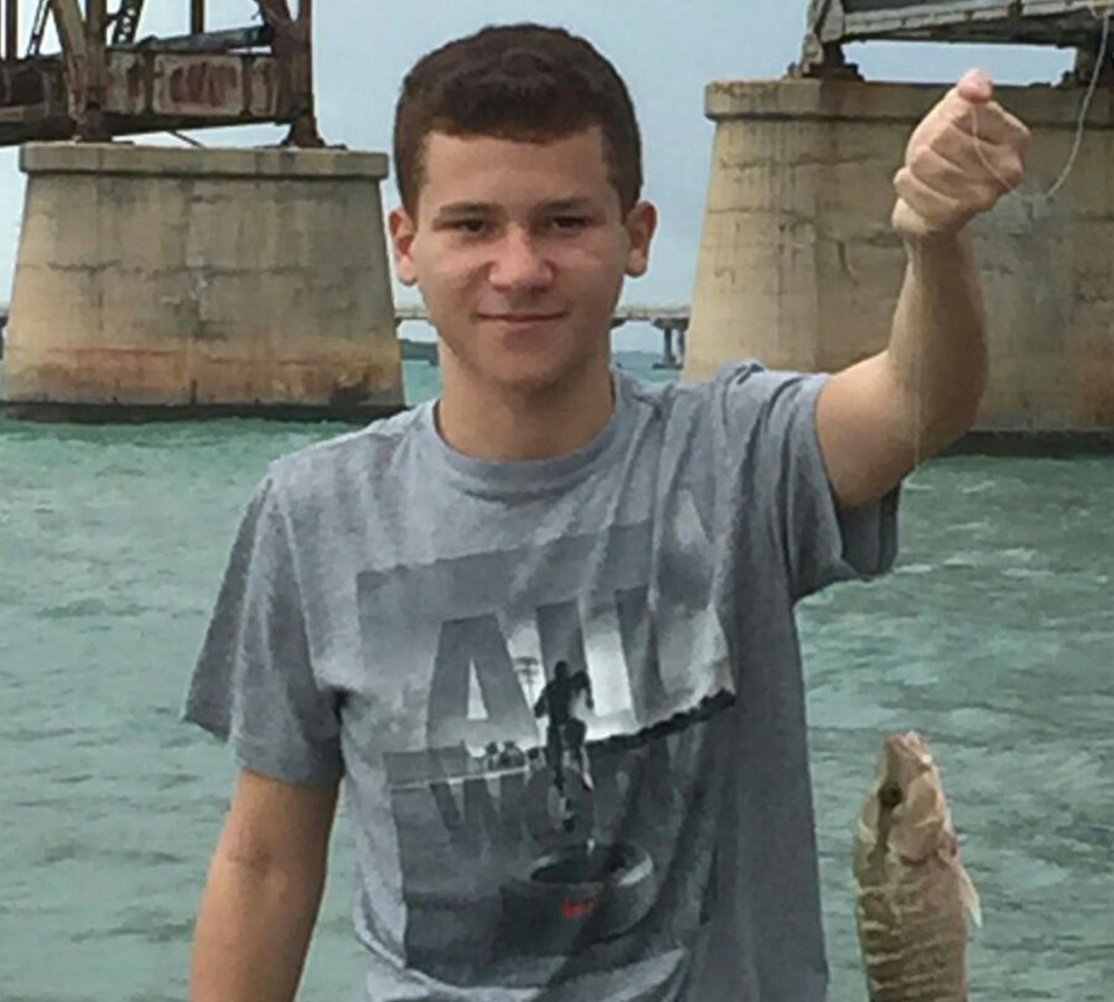 Sebastian DeLeon, shown on a fishing outing, is expected to recover after being treated at an Orlando hospital for an infection that has a fatality rate of 97 percent.
