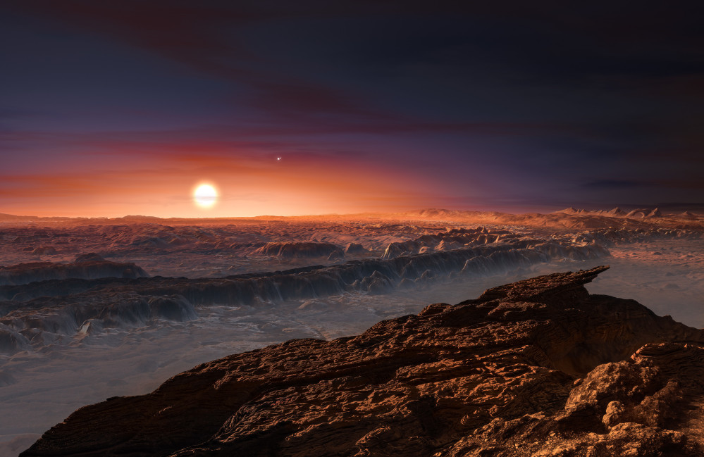 This artist rendering depicts a view of the surface of the planet Proxima b orbiting the red dwarf star Proxima Centauri, the closest star to our solar system. The double star Alpha Centauri AB also appears in the image to the upper-right of Proxima itself.