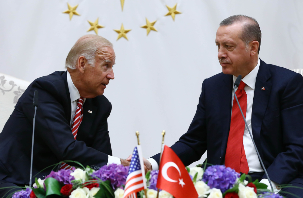 U. S. Vice President Joe Biden, left, and Turkish President Recep Tayyip Erdogan shake hands Wednesday in Ankara, Turkey, where Biden reiterated the commitment of both countries to defeat the Islamic State.