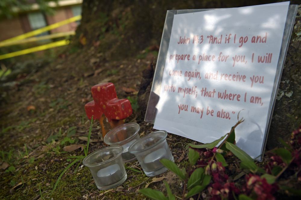 A memorial is placed outside the crime scene tape at the home in Durant, Miss., where Sister Margaret Held and Sister Paula Merrill were found slain Thursday morning.
