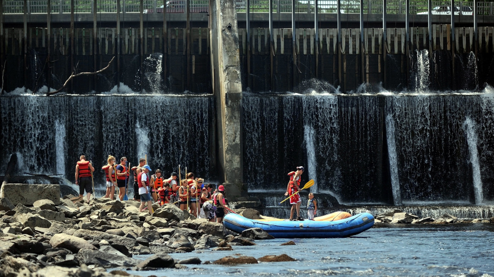 Rafters wait to board rafts operated by Moxie Outdoor Adventures for free rides down the Kennebec River in Skowhegan as part of a past River Fest. Free rides will be available Saturday at this year's event.