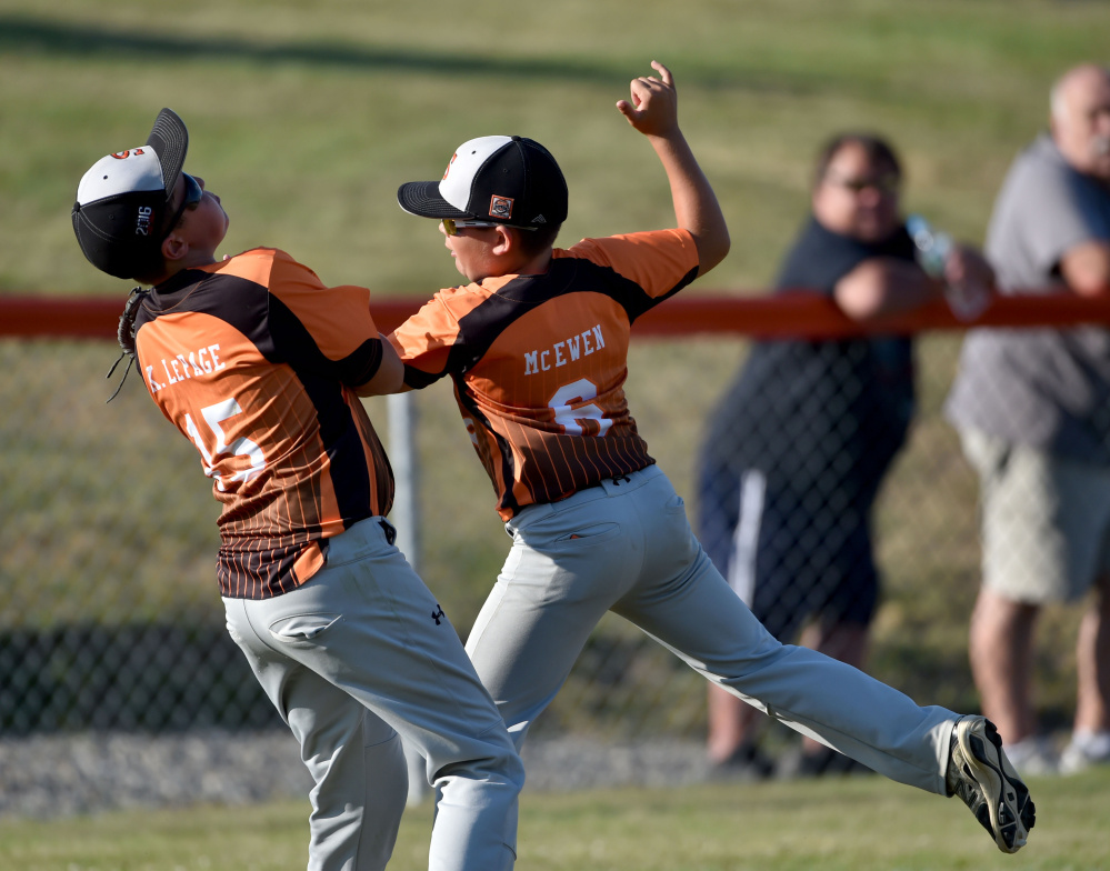 Skowhegan second baseman Hunter McEwen (6) collides with right fielder Kyle LePage (15) as he makes the catch against Marlboro, Massachusetts in the 11U Cal Ripken New England tournament Wednesday at the Carl Wright Complex in Skowhegan.