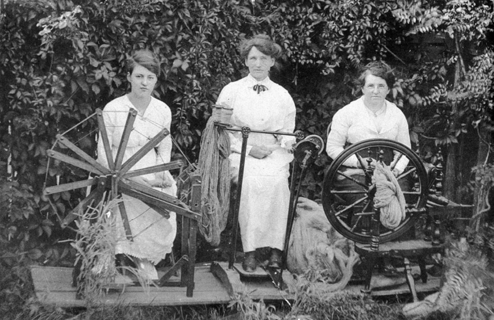 Spinners spinning wool into yarn for the Knitting Brigades of WWI.