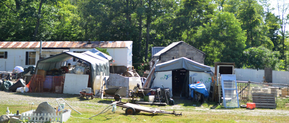 The Oakland Town Council will discuss the status of 8 Smithfield Road, which town officials say is in violation of the town's property maintenance ordinance because of the amount of clutter in the yard.