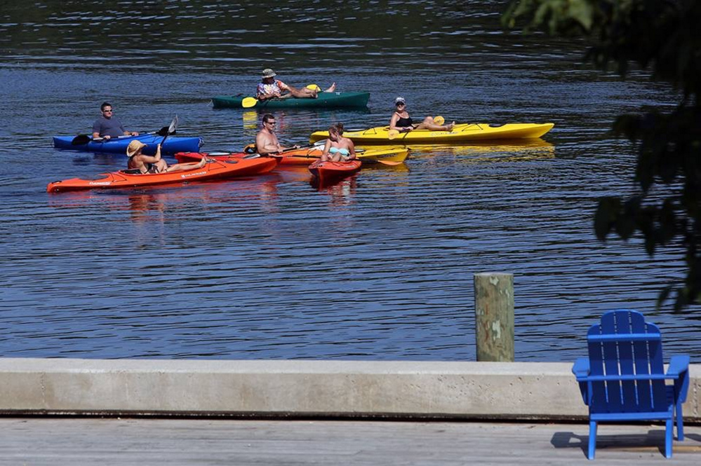 Kayakers enjoy last years Woodstock Revival from the Kennebec River.