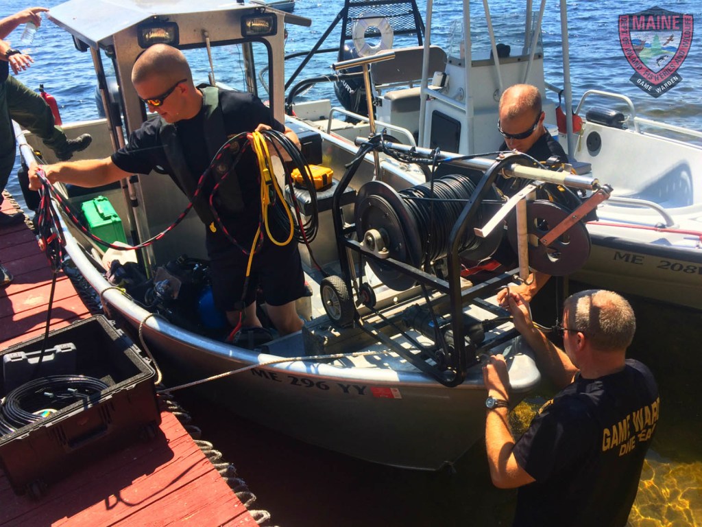Side scan sonar is fitted to the front of a Maine Warden Service boat Thursday in the search for the teenager from Hollis who fell off a boat in Long Lake on Wednesday.