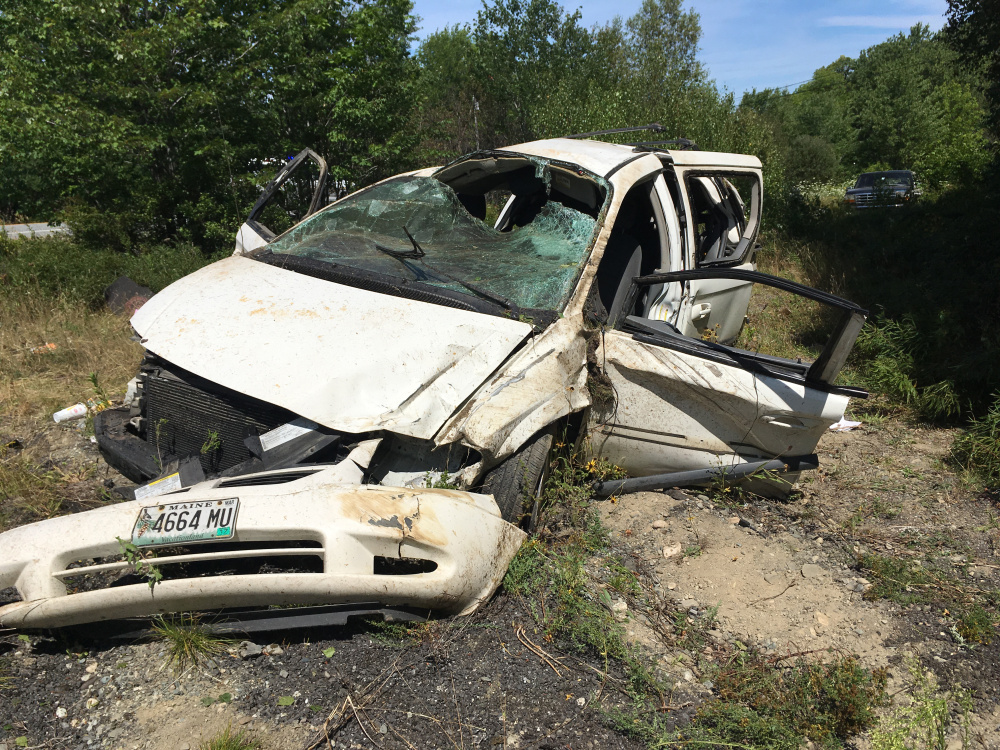 A 2005 Dodge Caravan driven by Shanya Pottle, 20, of South China, rests by the side of U.S. Route 201 in Madison after a one-vehicle crash Tuesday morning. Pottle was seriously injured, according to the Somerset County Sheriff's Department.