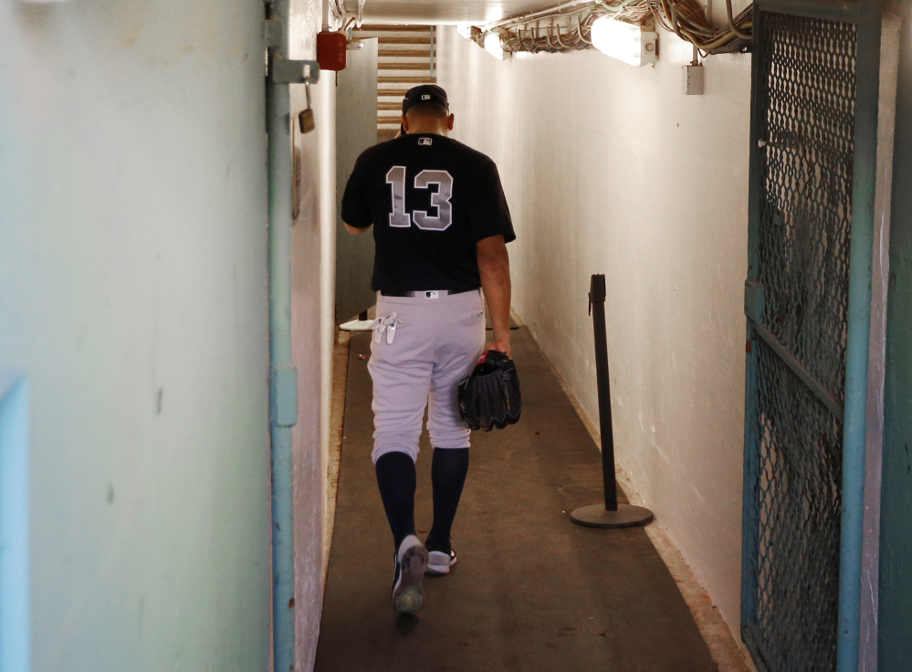 New York Yankees infielder Alex Rodriguez walks back down the tunnel to the clubhouse before the team's game against the Red Sox at Fenway Park in Boston on Tuesday.