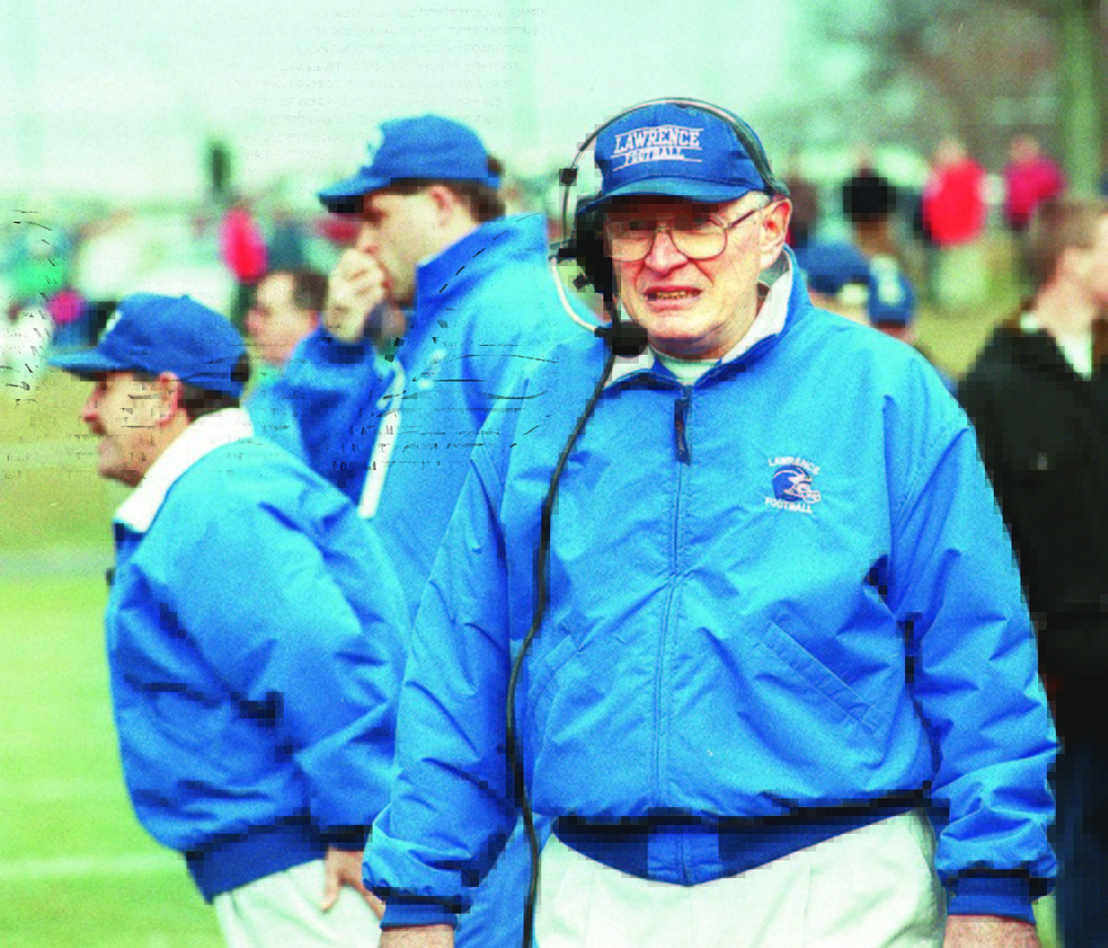 Lawrence coach Pete Cooper, front, watches the action during the 1996 Class A state championship game against South Portland.