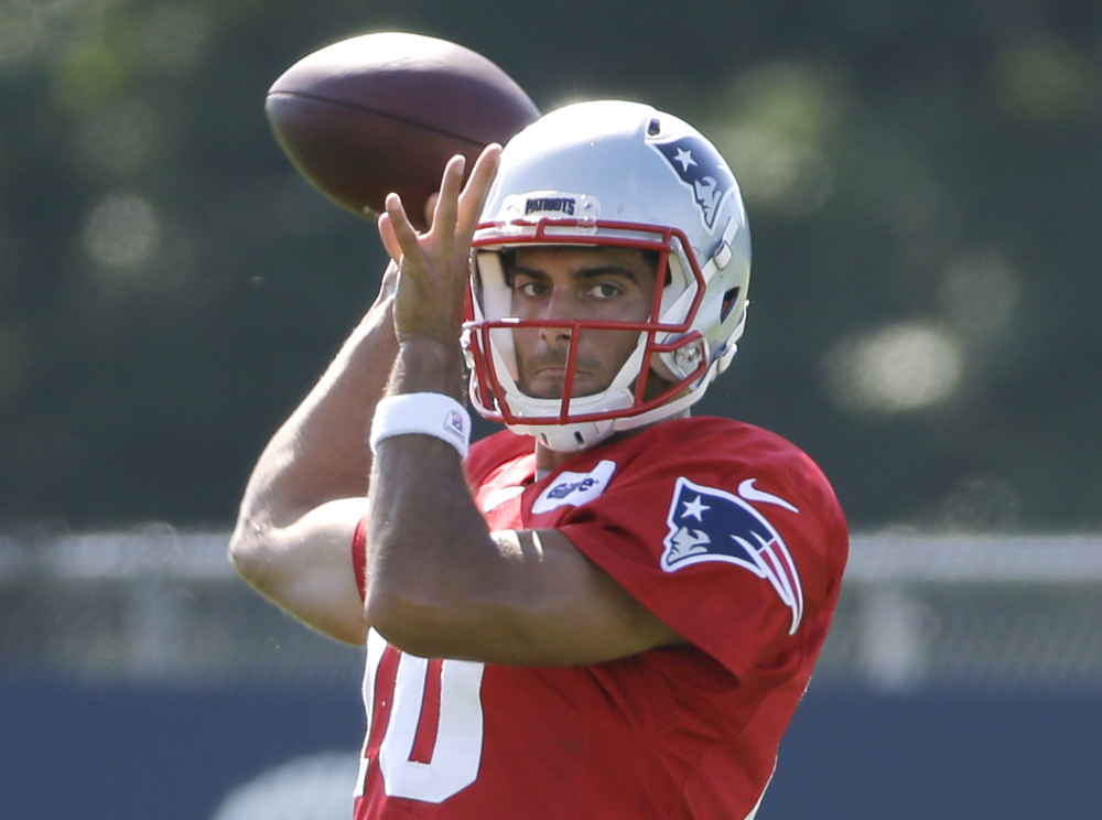 New England Patriots quarterback Jimmy Garoppolo throws a pass during training camp Tuesday in Foxborough, Massachusetts.