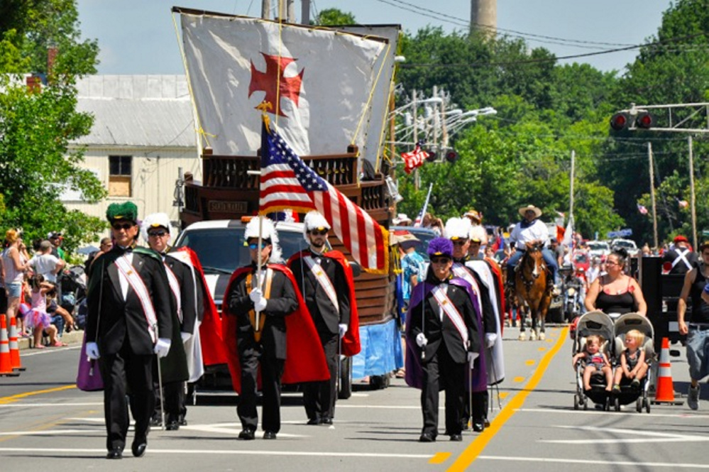 The Knights of Columbus march in the Winslow Family 4th of July parade on July 4. Organizers of the annual event say the town is increasing its fees in an effort to drive the celebration elsewhere.