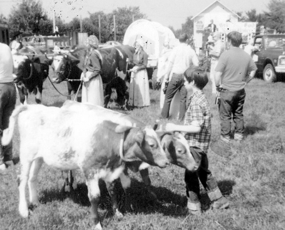 Peter Monti, front and center, of Jefferson, had this pair of young steers in the 1976 July 4th parade in the United States Bicentennial year. In the background are pioneers Claudia and Claudene Orff with their oxen hauling a pioneer wagon. This photo is one of many on display at the Jefferson Historical Society's open houses planned for Aug. 17 and 24. Also available will be the 2017 Jefferson Historical Photo Calendar.