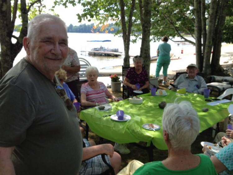 George Fowler, left, attends a picnic Aug. 6 at Unity Pond in Burnham for the widows-and-widowers' group he formed about 10 years ago.