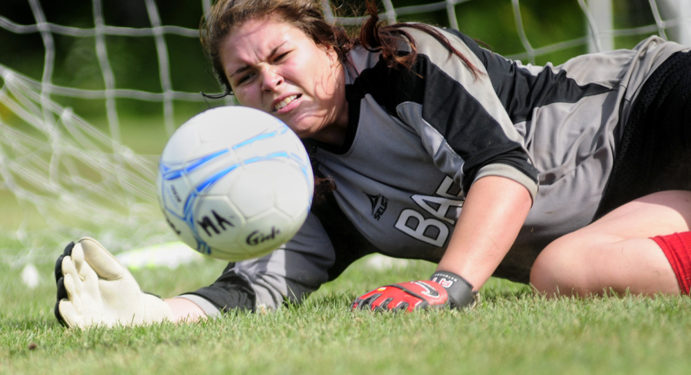 Monmouth Academy girls goalie Destiny Clough makes a save during practice Tuesday at Monmouth Academy in Monmouth.