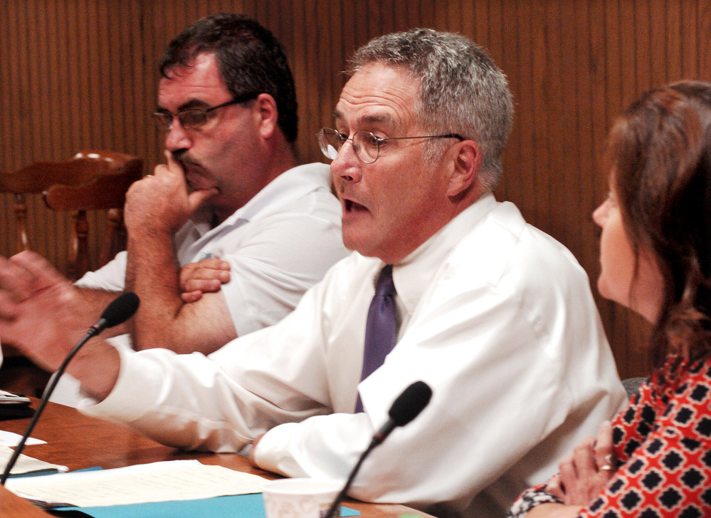 Waterville City Councilor Chairman John O'Donnell, center, makes a motion during a heated discussion of the municipal and school budgets on Tuesday. O'Donnell is flanked by councilors Sydney Mayhew, left, and Dana Bushee.