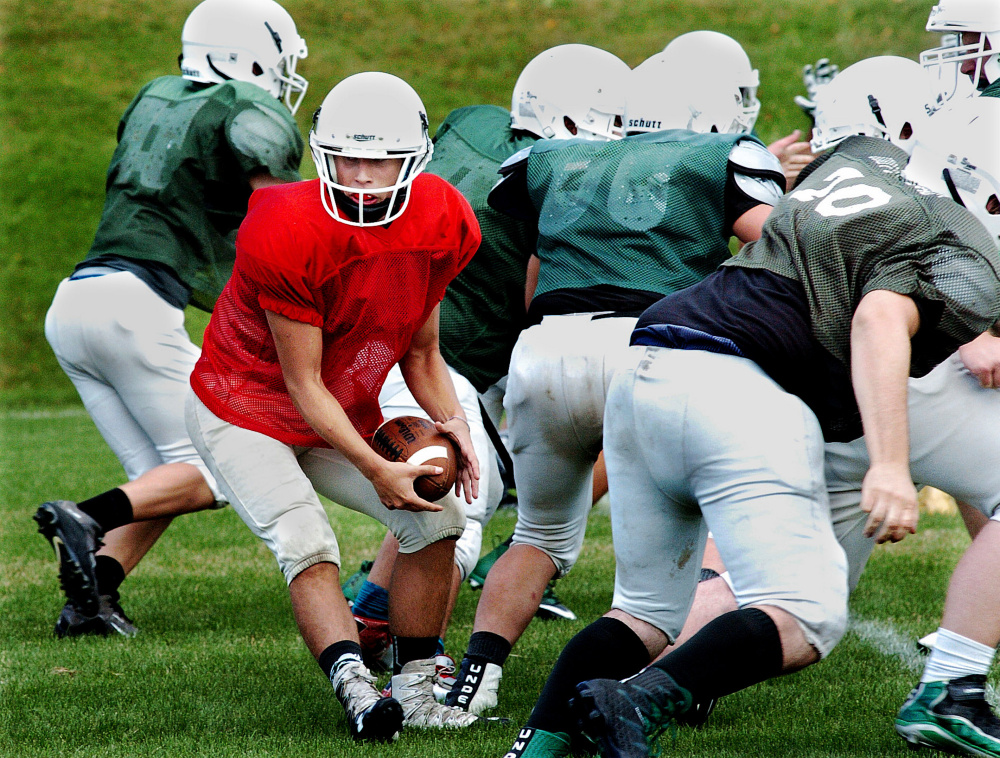 Mount View quarterback Rayno Boivin looks to hand off the ball during a scrimmage in Pittsfield on Monday.