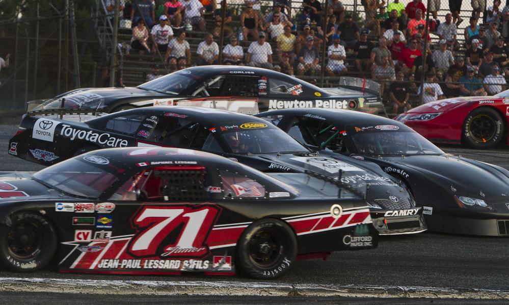 Cars get spun around on the first corner of the track early in the Oxford 250 last August at Oxford Plains Speedway.