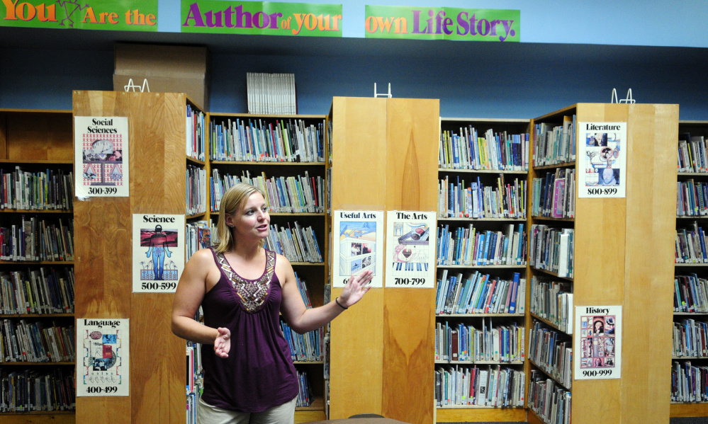 Librarian Marcie Abbott talks about renovation in the library Thursday at Whitefield Elementary School.