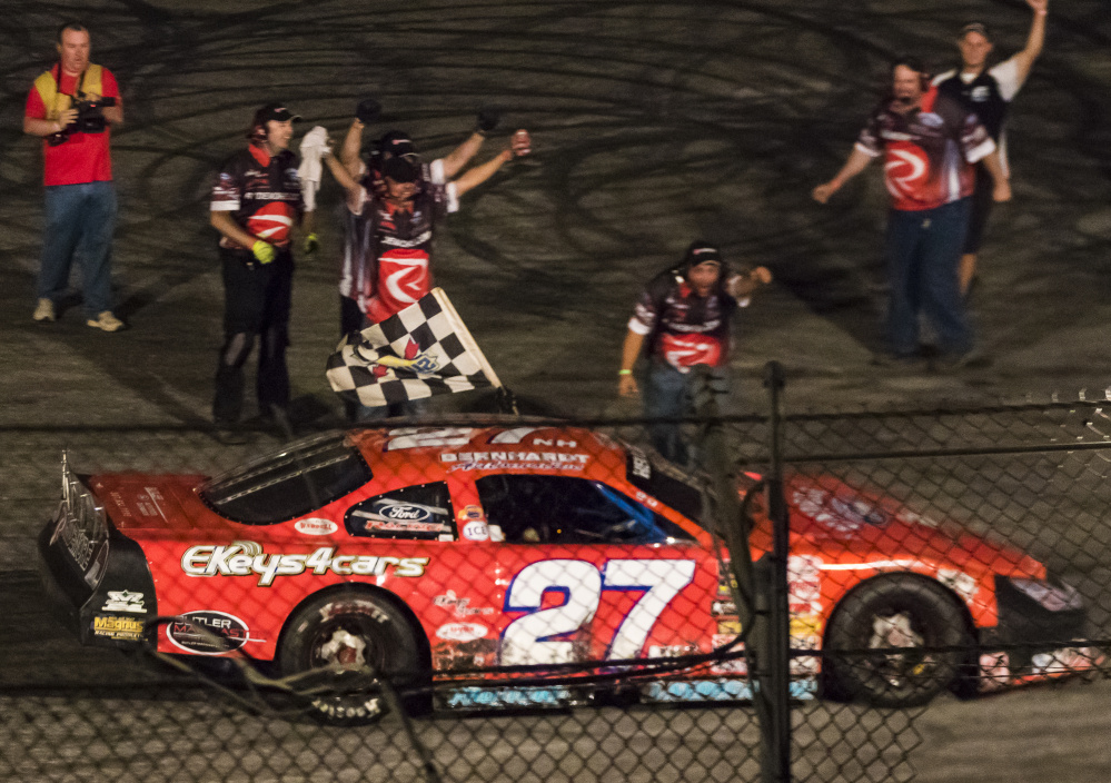Wayne Helliwell Jr.'s pit crew celebrates after Helliwell won the Oxford 250 on Sunday night at Oxford Plains Speedway in Oxford.