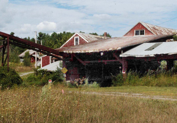 This former deteriorated sawmill in Vassalboro at the Masse Dam is expected to be torn down so water pipes below it will not be damaged and cut off water supplies when the dam is removed as part of the Alewife Restoration Initiative.