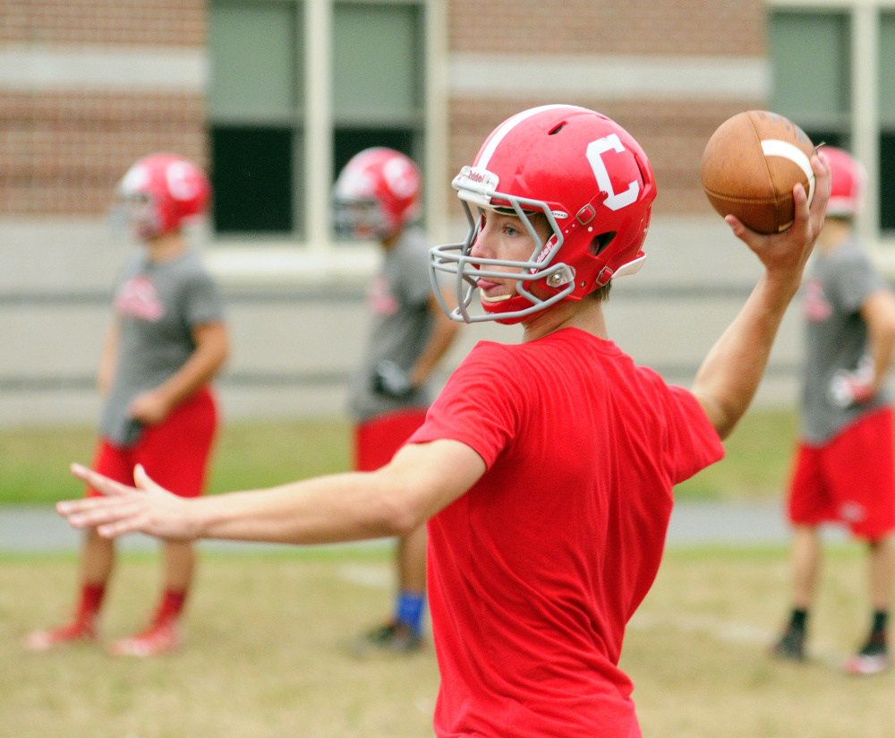 Cony quarterback Taylor Heath winds up to pass during an Aug. 16 practice at Cony High in Augusta.