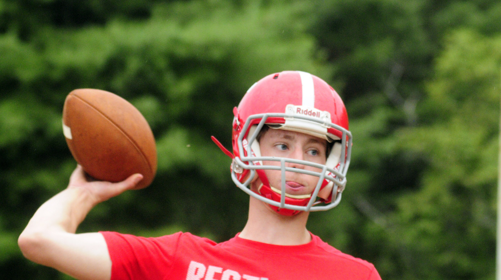 Cony quarterback Taylor Heath winds up to pass during an Aug. 16 practice at Cony High in Augusta.