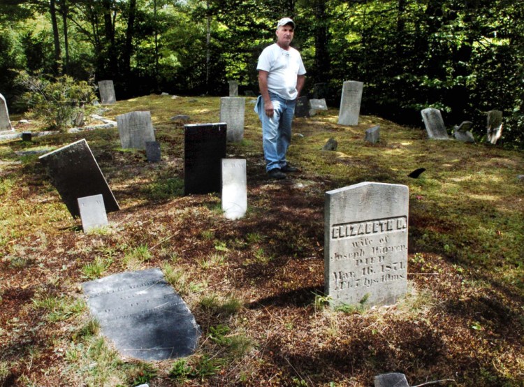 Peter Fotter talks about the town-owned Tuttle Cemetery in Rome, which is accessible by traveling down Fotter's driveway off Oak Ridge and onto a path through brush and forest on his property.