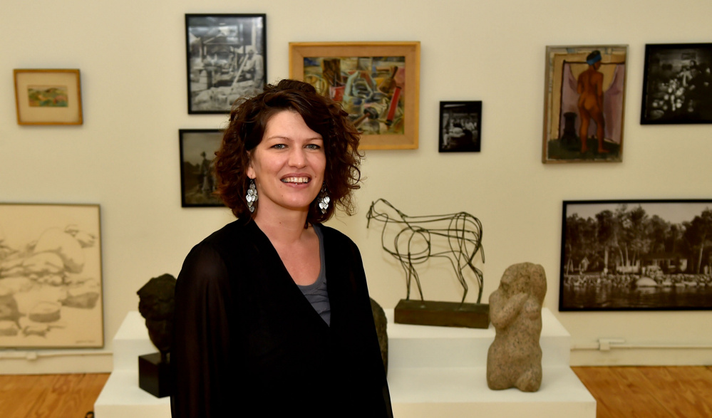 Shannon Haines, center, president and CEO of Waterville Creates!, poses for a portrait Wednesday at the Common Street Arts gallery at The Center in downtown Waterville.
