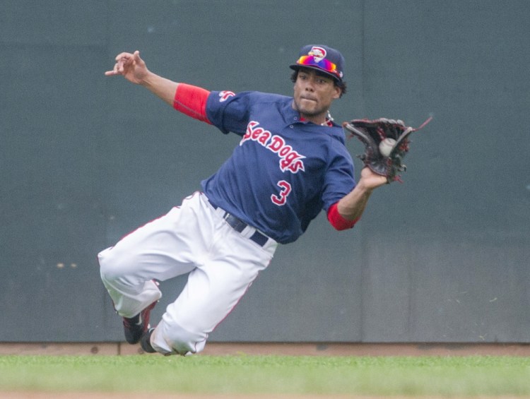 Sea Dogs outfielder Aneury Tavarez makes a sliding catch on a sinking liner against the Fisher Cats at Hadlock Field on July 26. Tavarez leads the Eastern League with a .330 average.