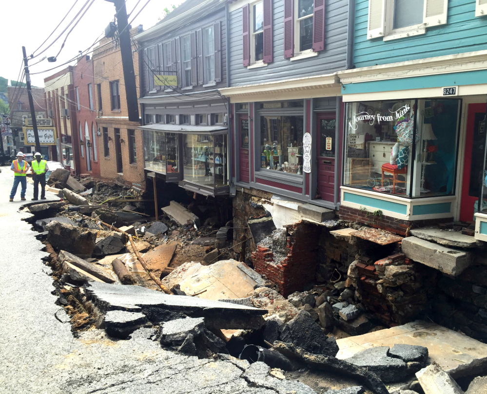 Low-lying Ellicott City, Maryland, was ravaged by floodwaters Saturday night, killing a man and a woman, and causing devastating damage to homes and businesses.