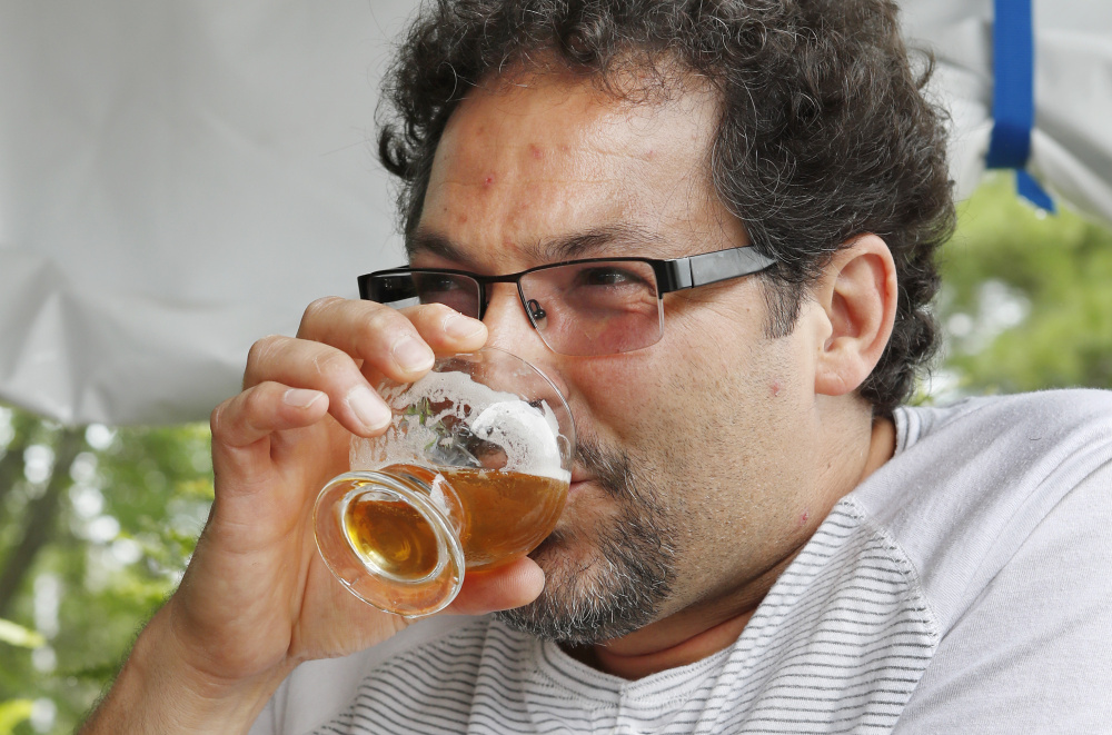 Joe Mondo of Frederick, Maryland, samples a beer at the Maine Beer Co. on Monday.