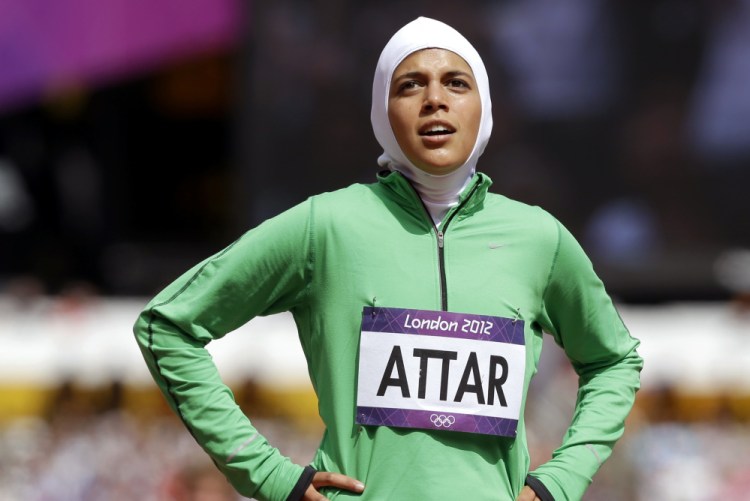 Sarah Attar reacts after competing for Saudi Arabia in a women's 800-meter heat in the 2012 London Olympics. Forget the last-place finish – Attar joined judoka Wojdan Shaherkani as Saudi Arabia's first female Olympians.