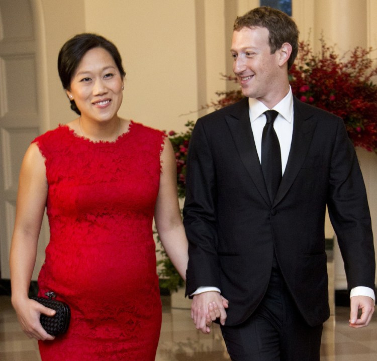 Facebook CEO Mark Zuckerberg, seen in 2015 with his wife, Priscilla Chan, offers 16 weeks of paid leave to new parents. Zuckerberg took two months off to care for his daughter.