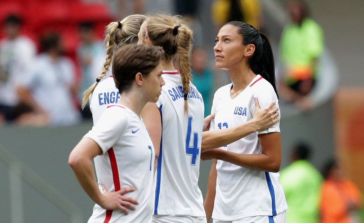 United States' Christen Press is comforted by a teammate after missing a penalty kick during a shoot-out against Sweden at a quarterfinal match of the women's Olympic football tournament in Brasilia on Friday. The United States was eliminated by Sweden.