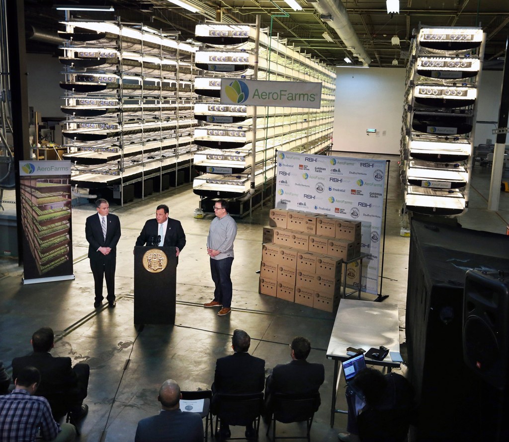 New Jersey Gov. Chris Christie, center at podium, addresses a March 24 gathering at AeroFarms, a vertical farming operation in Newark. 