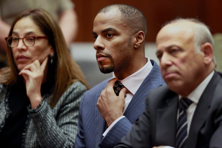 Former NFL safety Darren Sharper, center, appears with his attorneys in Los Angeles Superior Court in March 2015. 
Associated Press/Nick Ut