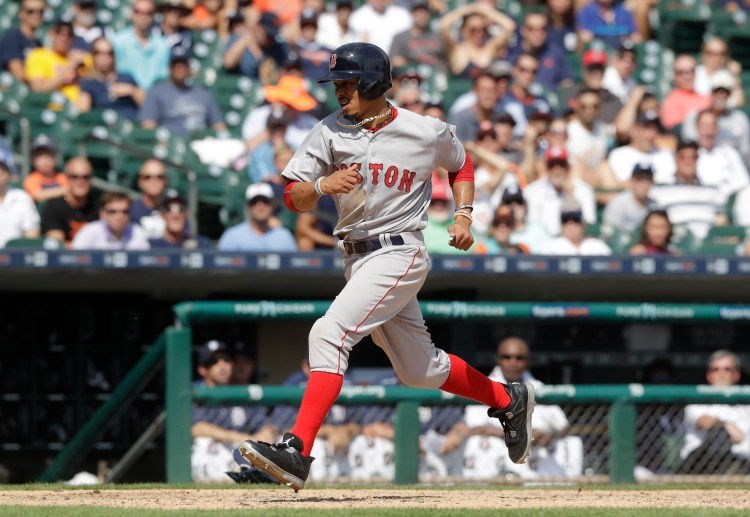 Boston's Mookie Betts scores on a wild pitch during the eighth inning against the Tigers on Thursday in Detroit. Associated Press/Carlos Osorio