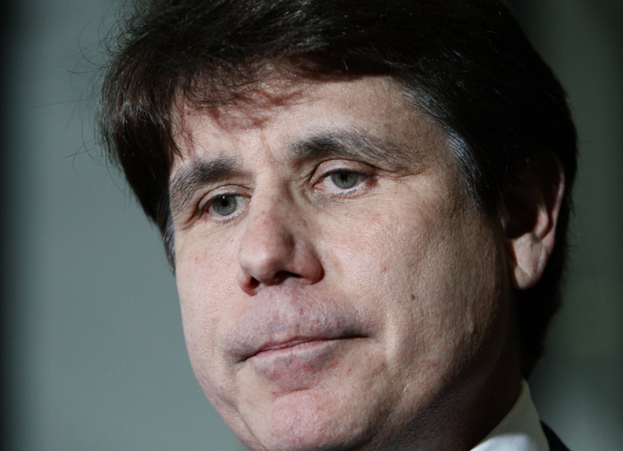 In this June 9, 2011, photo former Illinois Gov. Rod Blagojevich pauses as he talks with reporters at the Federal Court building in Chicago.