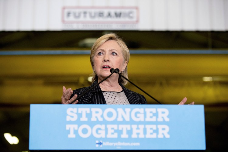 Democratic presidential candidate Hillary Clinton promotes her plan to invest in infrastructure after touring Futuramic Tool & Engineering in Warren, Mich., on Thursday.