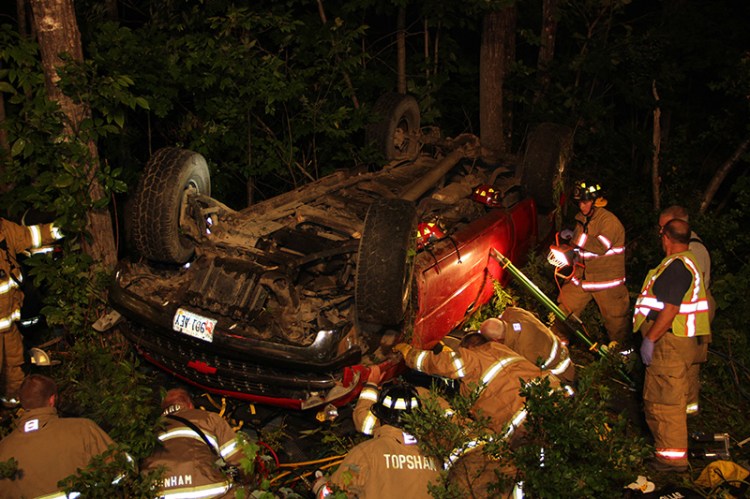 Scene of a crash in Bowdoin Wednesday night that injured the driver and two passengers. The pickup truck overturned off Rte. 138.