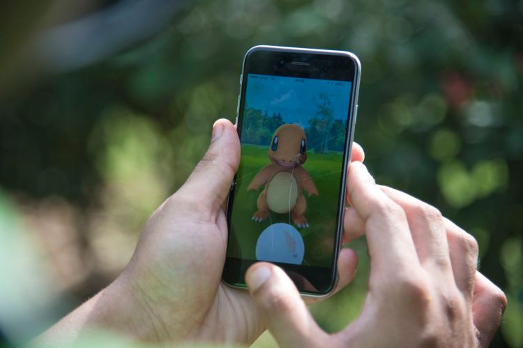 A Pokemon Go player is trying to catch Charmander, one of Pokemon's most iconic creature. New York Gov. Andrew Cuomo is concerned that "lures," a feature in the game that allows a player to attract Pokemon to a specific location, could also be used by predators to attract children hunting the critters.Thomas Cytrynowicz/Associated Press